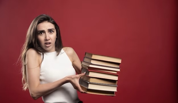 Young girl holding a book in her hands