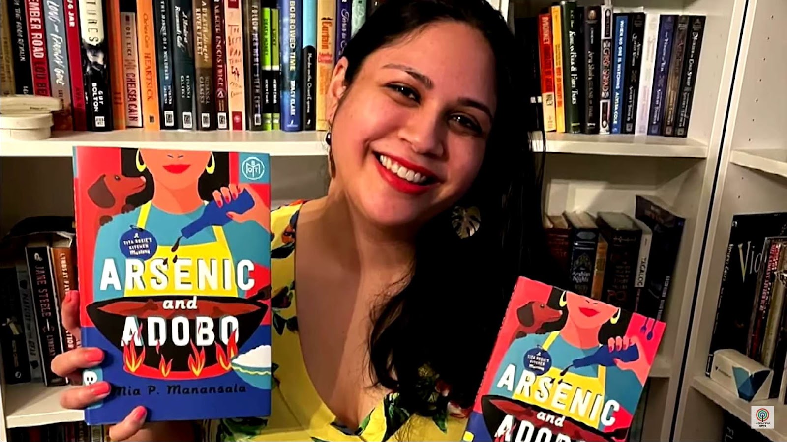 Mia P. Manansala with her book "Arsenic and Adobo"