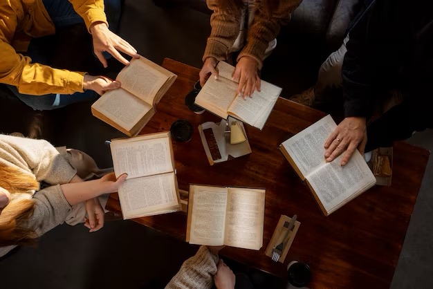 Top view of people reading together