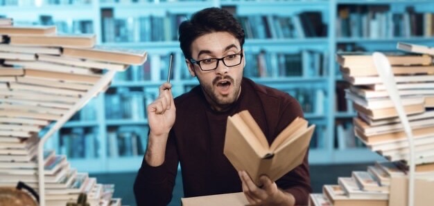 Man with glasses reading a book